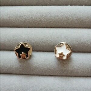 Black and white Star in star brooch/pins